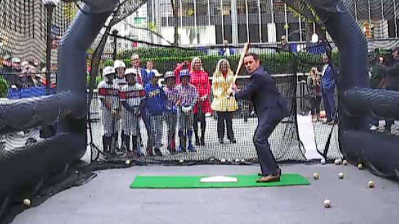 'Fox & Friends' hosts take a swing to celebrate the start of the World Series