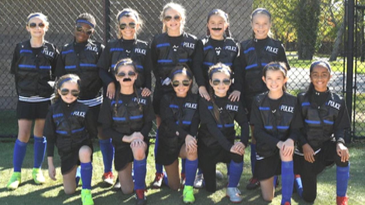 Youth girls soccer team honors police with 'thin blue line' uniforms