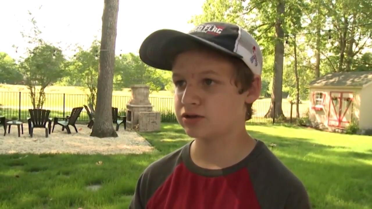 14 year old son of service member covers neighborhood in American flags