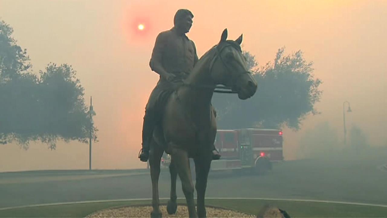 Fire crews work to protect the Ronald Reagan Presidential Library from fast-moving brushfire
