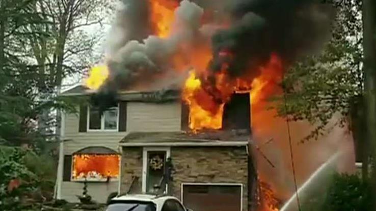 Small plane crashes into home, sparks intense fire in suburban New Jersey