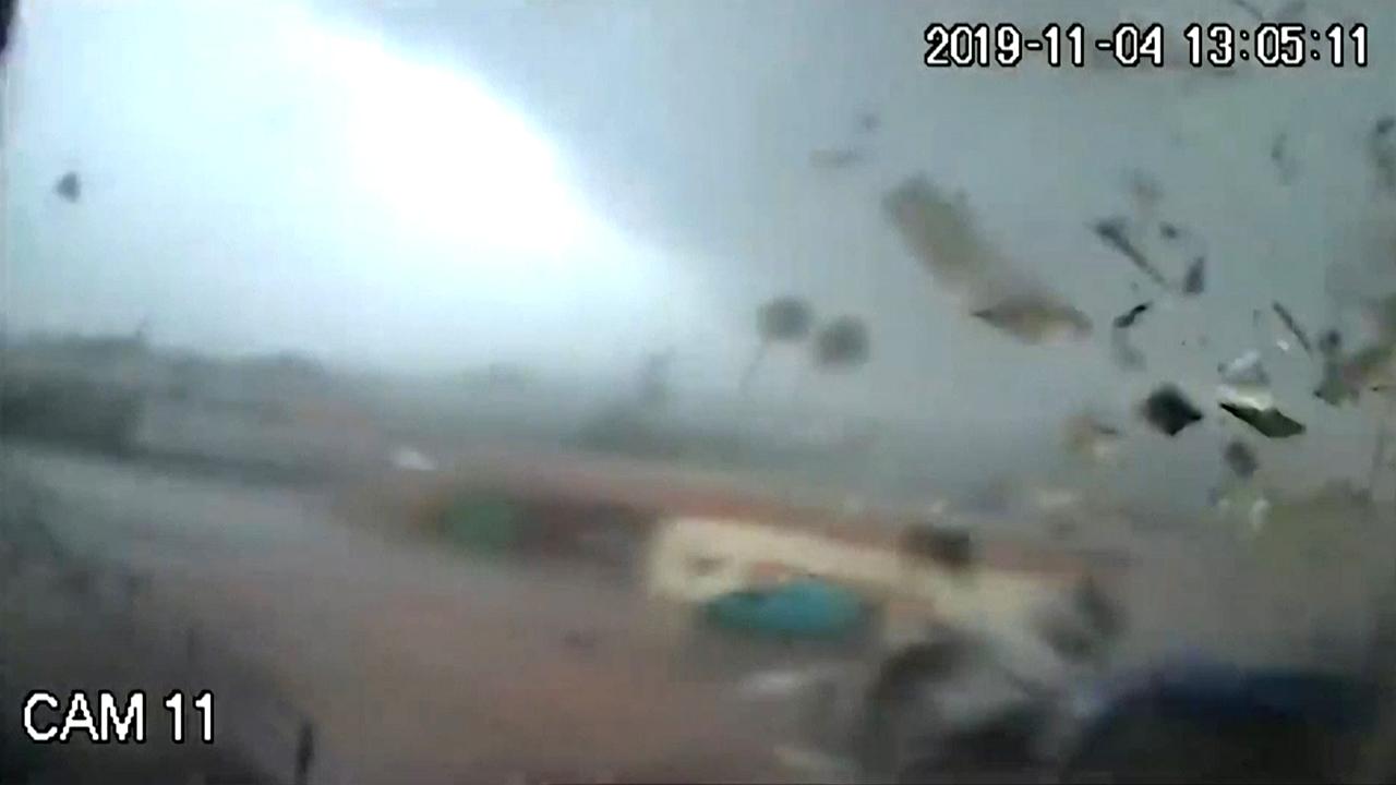 Surveillance cameras capture a tornado tearing across a factory in Greece