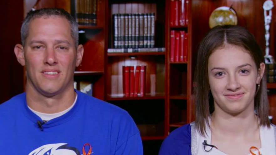 Ultimate cheer dad roots for daughter in viral video