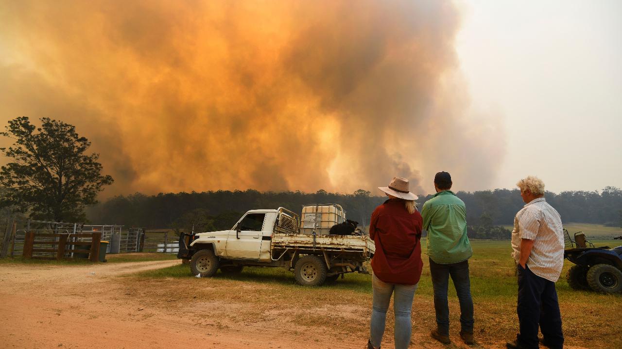 Australian firefighters struggle to fast-moving flames as bushfires rage out of control