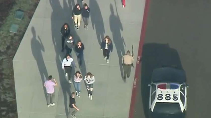 Law enforcement officers search for suspect in high school shooting in Southern California