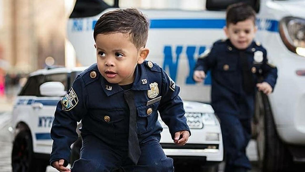 Adorable toddler ‘NYPD lieutenant’ twins travel the country to honor police officers and those who serve