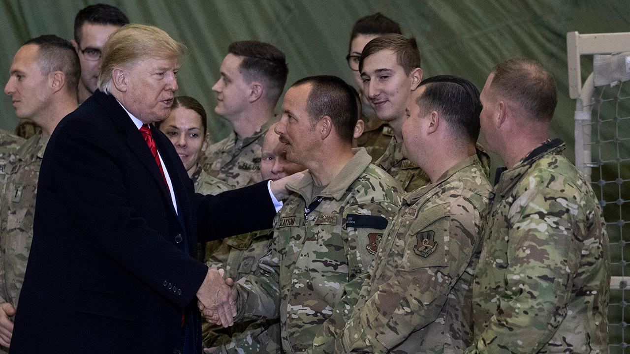 Trump says US will resume peace talks with Taliban during surprise Afghanistan visit