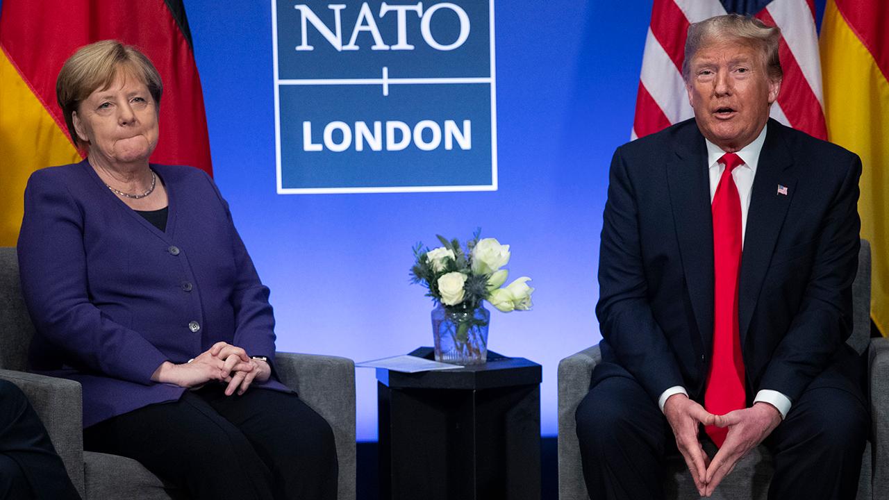 Trump, Merkel hold bilateral meeting on final day of NATO summit