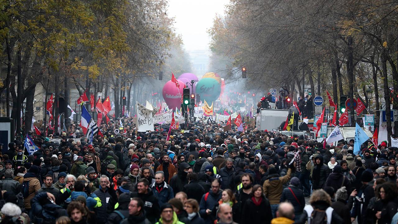 Pension protesters in Paris disrupt transit, close schools and Eiffel Tower