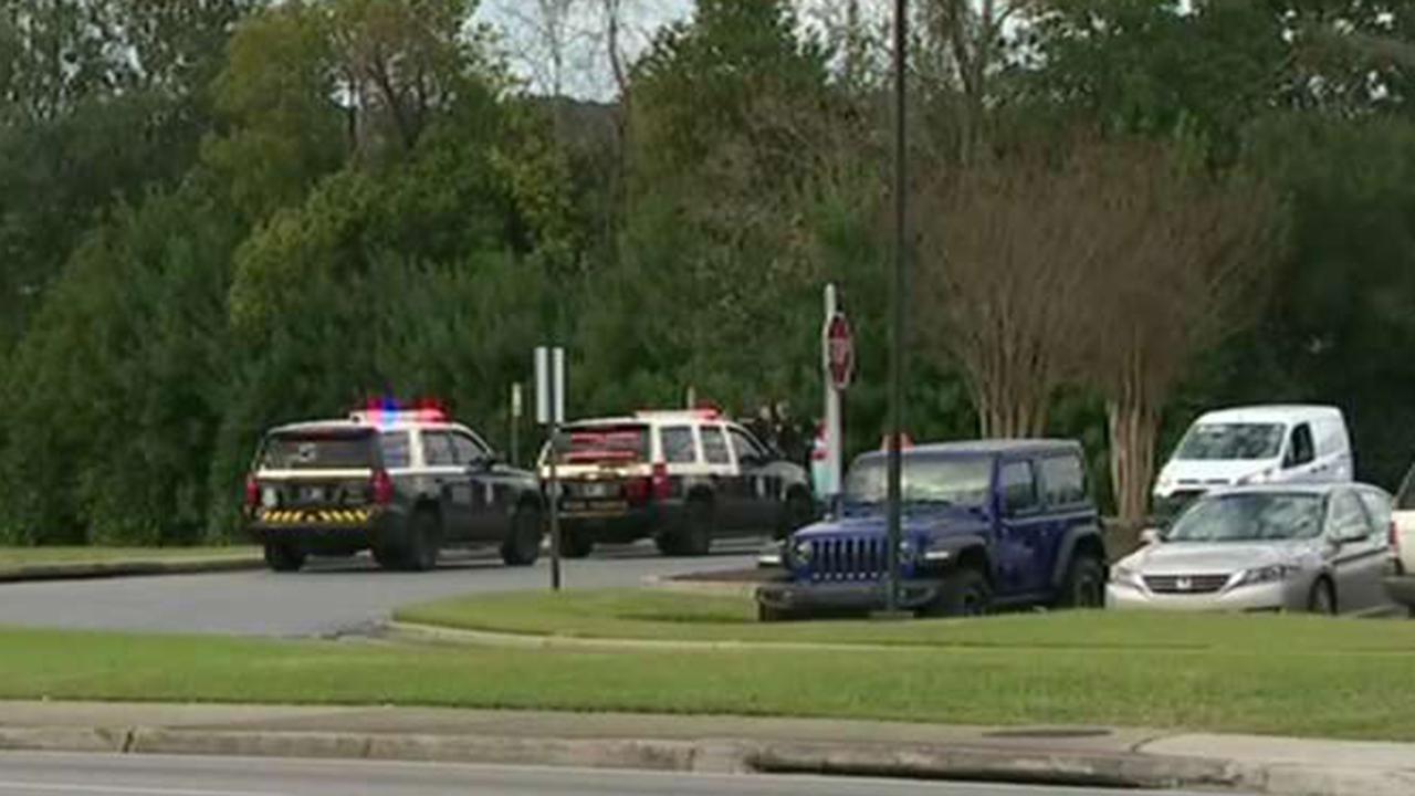 Naval Air Station Pensacola shooting witness heard about a dozen shots