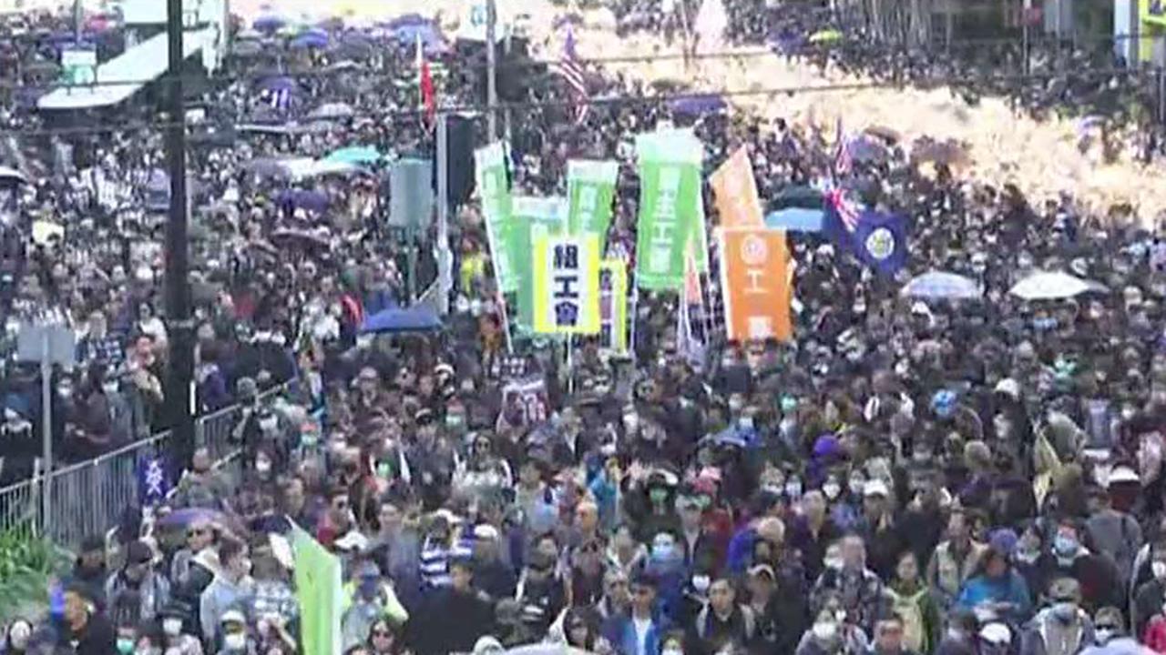 Hundreds of thousands participate in first government-approved march in Hong Kong since August