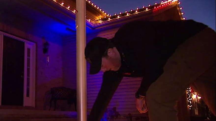 Veteran hangs Christmas lights for local heroes