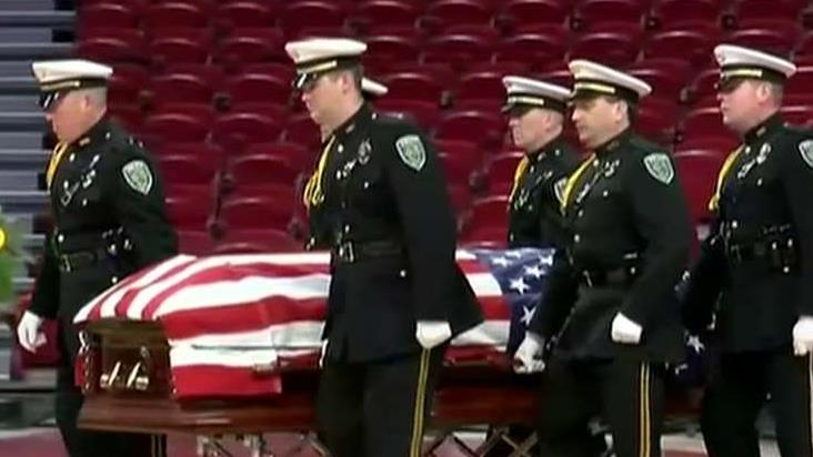 Arkansas officer honored and laid to rest after being 'ambushed and executed' in his patrol car
