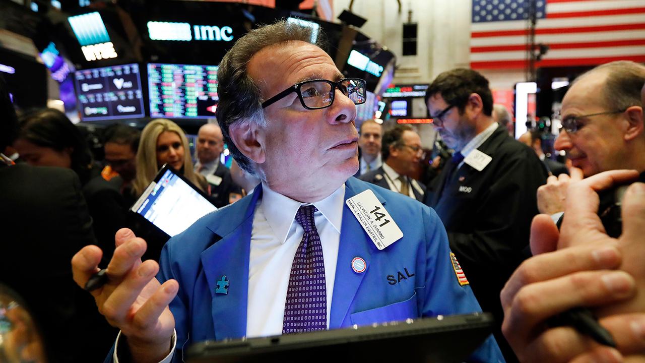 Dow hits new record, gains 10,000th point