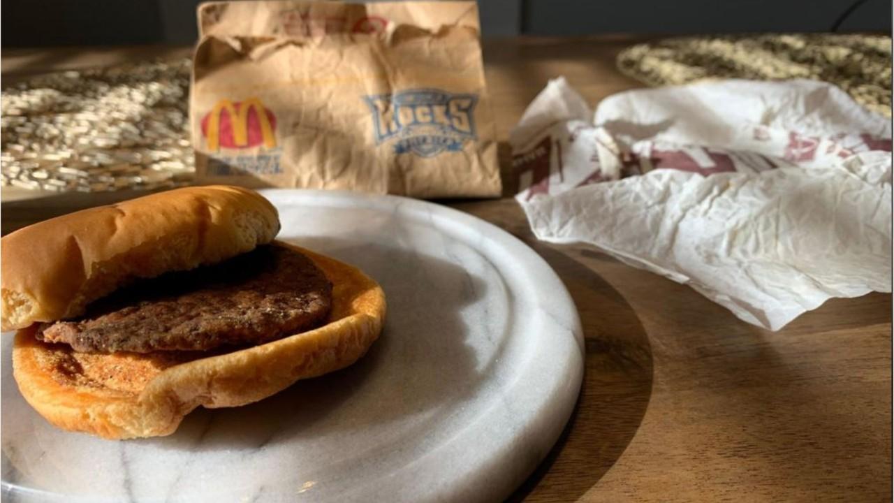 A Utah man unveils a hamburger he purchased from McDonald’s in 1999