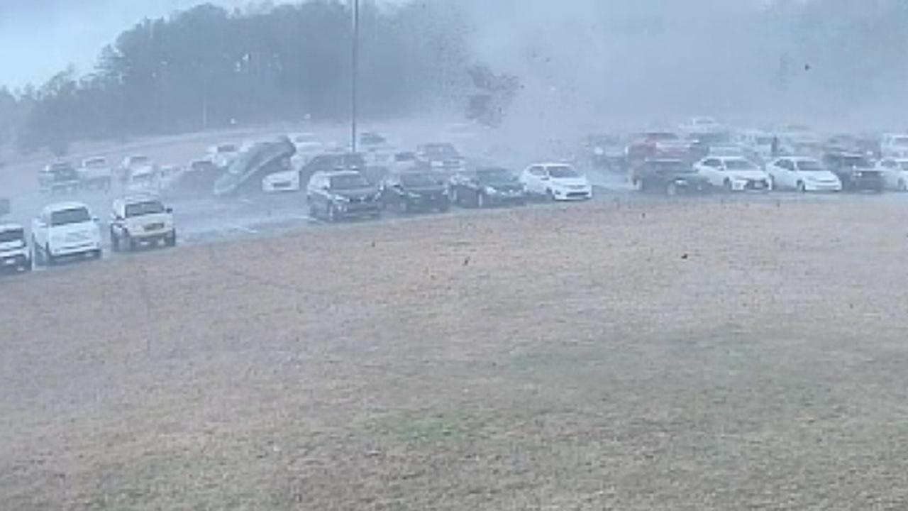 Tornado flips cars while tearing through high school parking lot in South Carolina