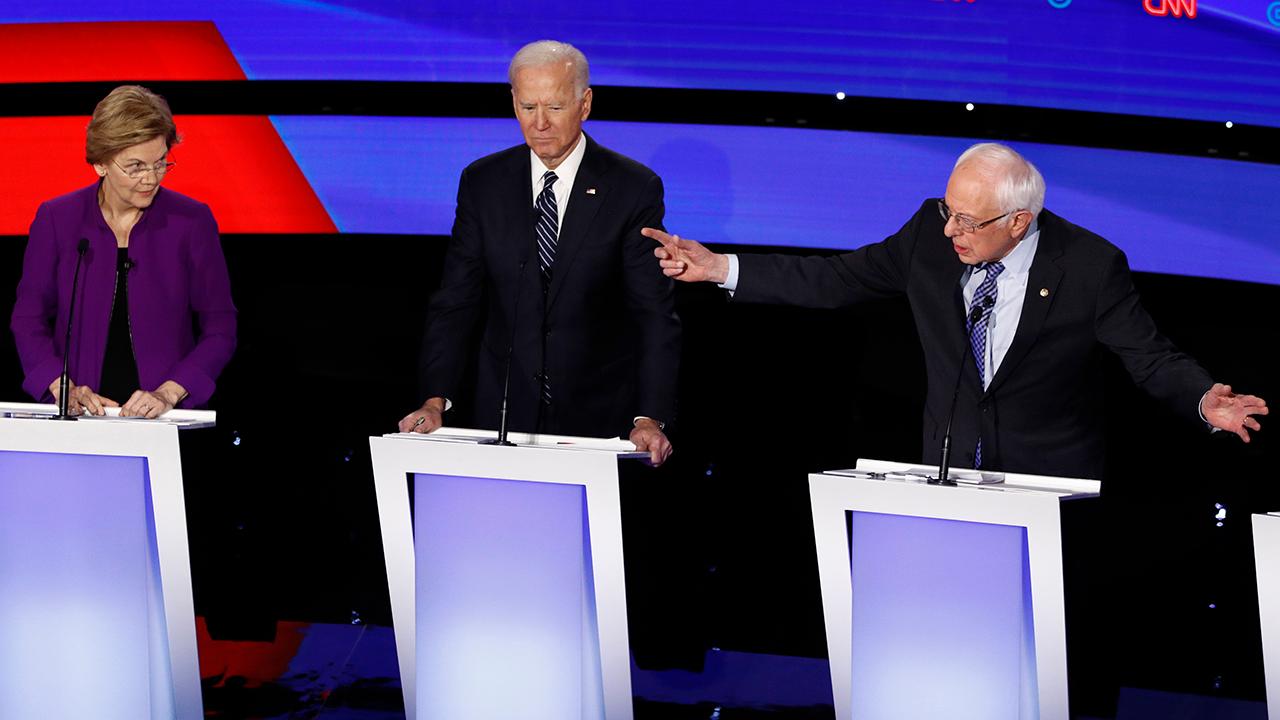 Hot mic captures tense exchange between Warren and Sanders