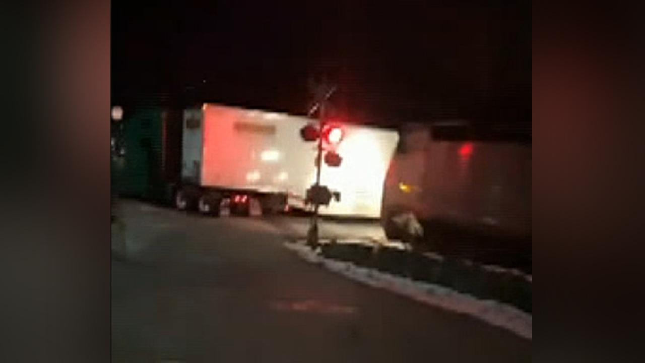 MTA commuter train collides with truck stranded on the tracks in New York