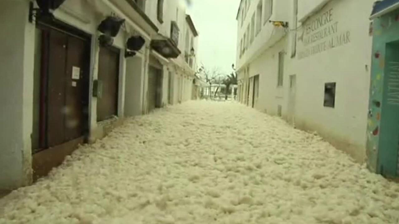 Sea foam floods streets of Spanish town during deadly storm