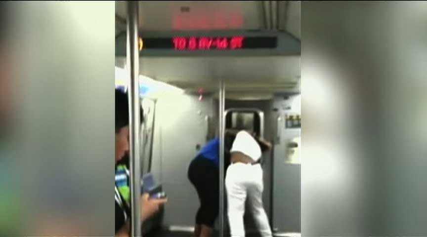 VIDEO: 2 Women Fight on NY Subway as Baby Stroller Rolls Out of Car
