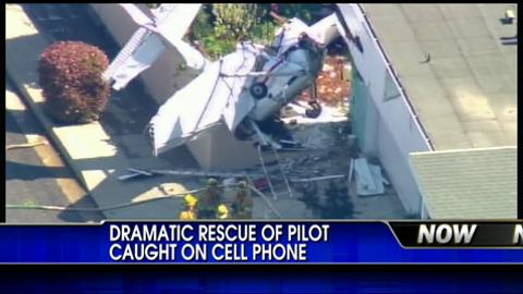 CELL PHONE VIDEO: Pilot Rescued After Plane Crashes Into Home