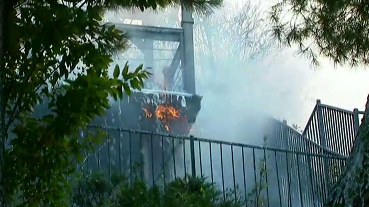 Homes burn near Los Angeles as Woolsey Fire explodes in size