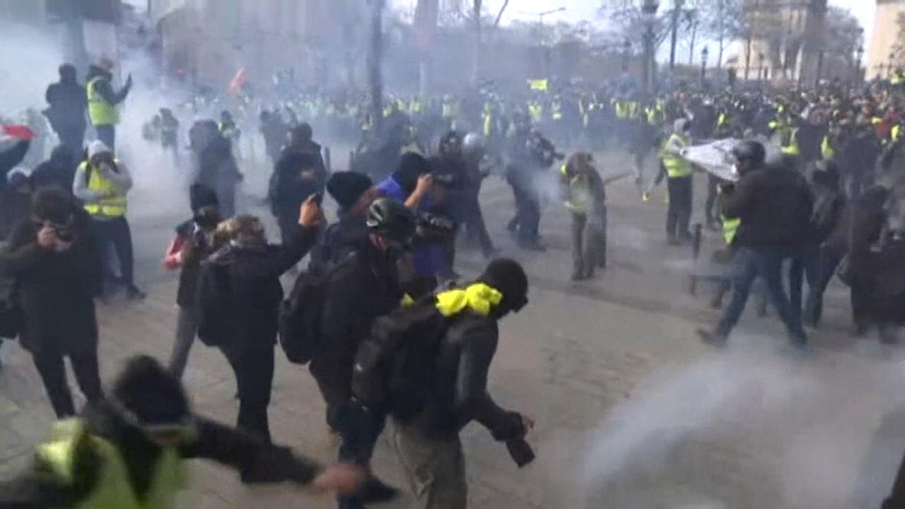 Police fire tear gas on protesters in Paris