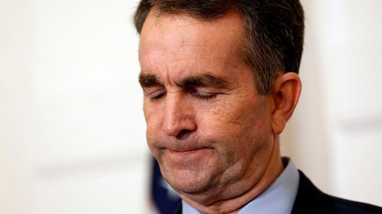 Virginia governor resists calls for his resignation following yearbook photo scandal