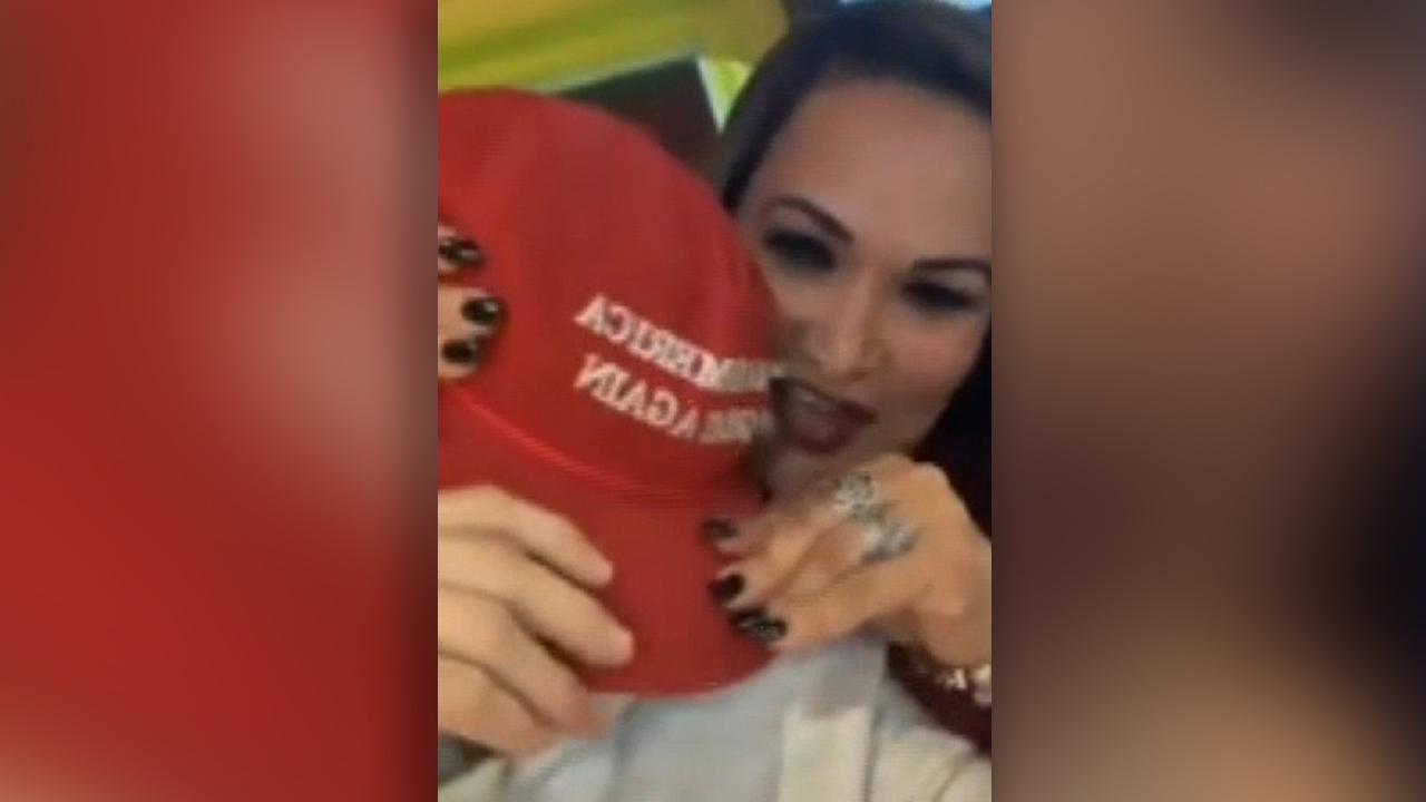 Woman arrested for alleged assault on man wearing a MAGA hat says she's the victim