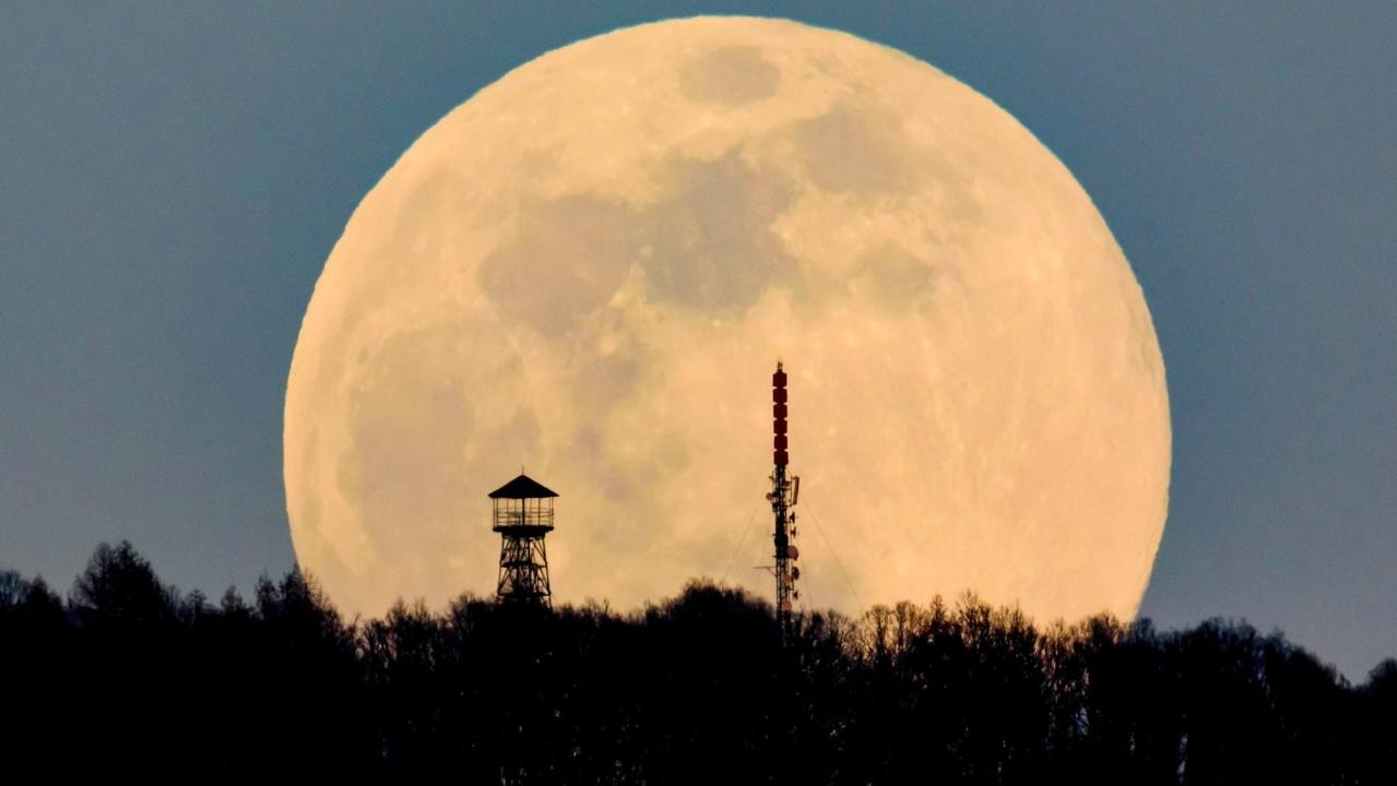 'Full worm supermoon' lights up the sky in stunning pictures