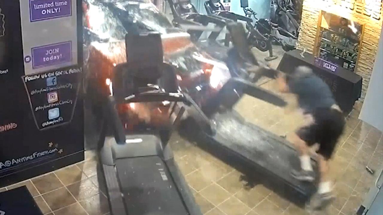 SUV slams into gym, injuring man on treadmill in scary crash caught on surveillance video