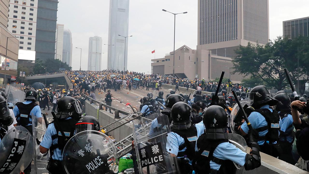 Thousands of demonstrators surround government buildings in Hong Kong, protest against extradition bill