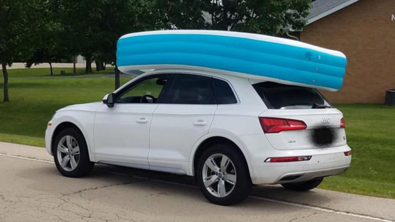 Mom caught cruising with 2 kids riding in an inflatable pool on top of her car