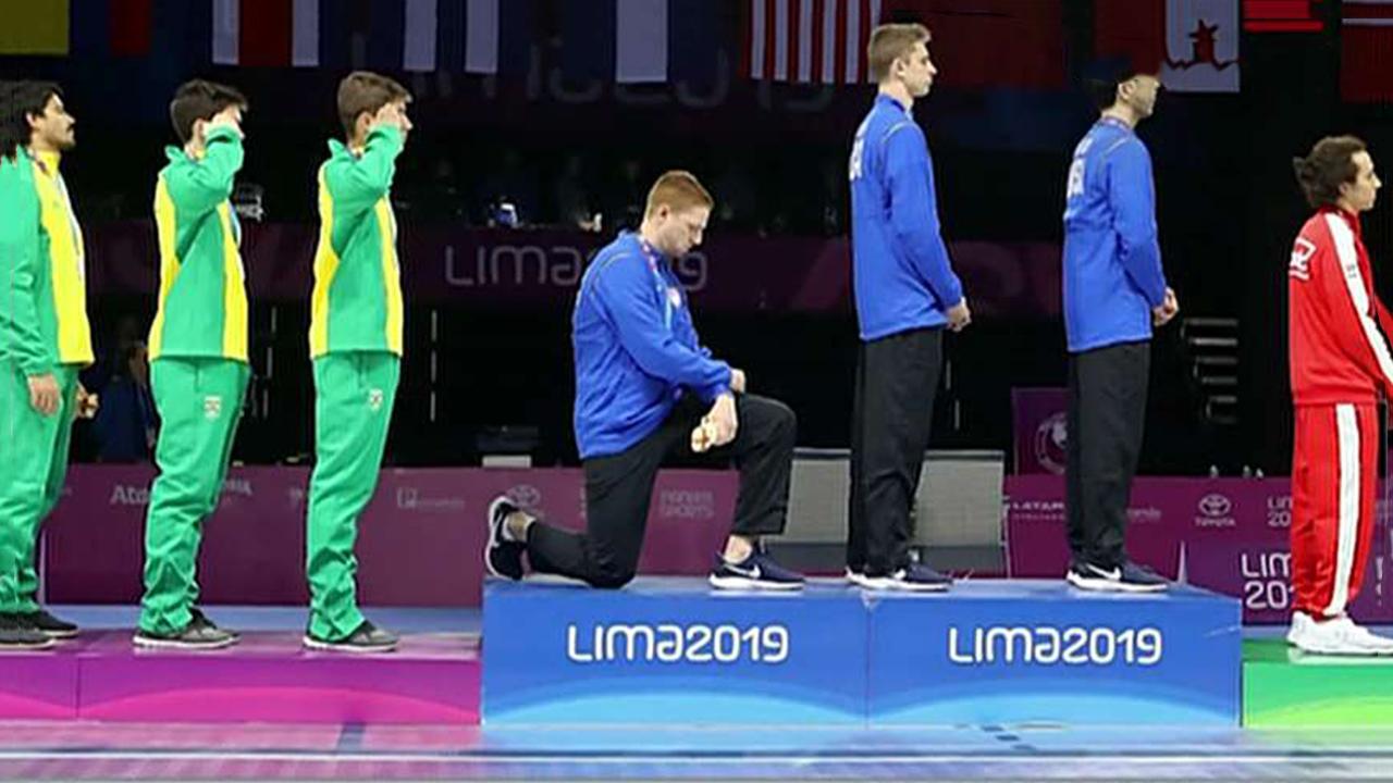 US medalists protest national anthem on world stage