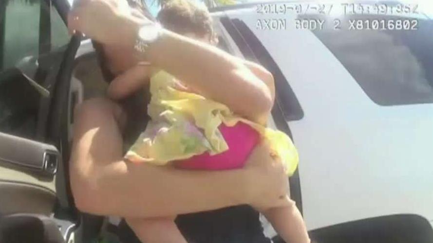 Florida officer smashes window to save baby locked in hot car