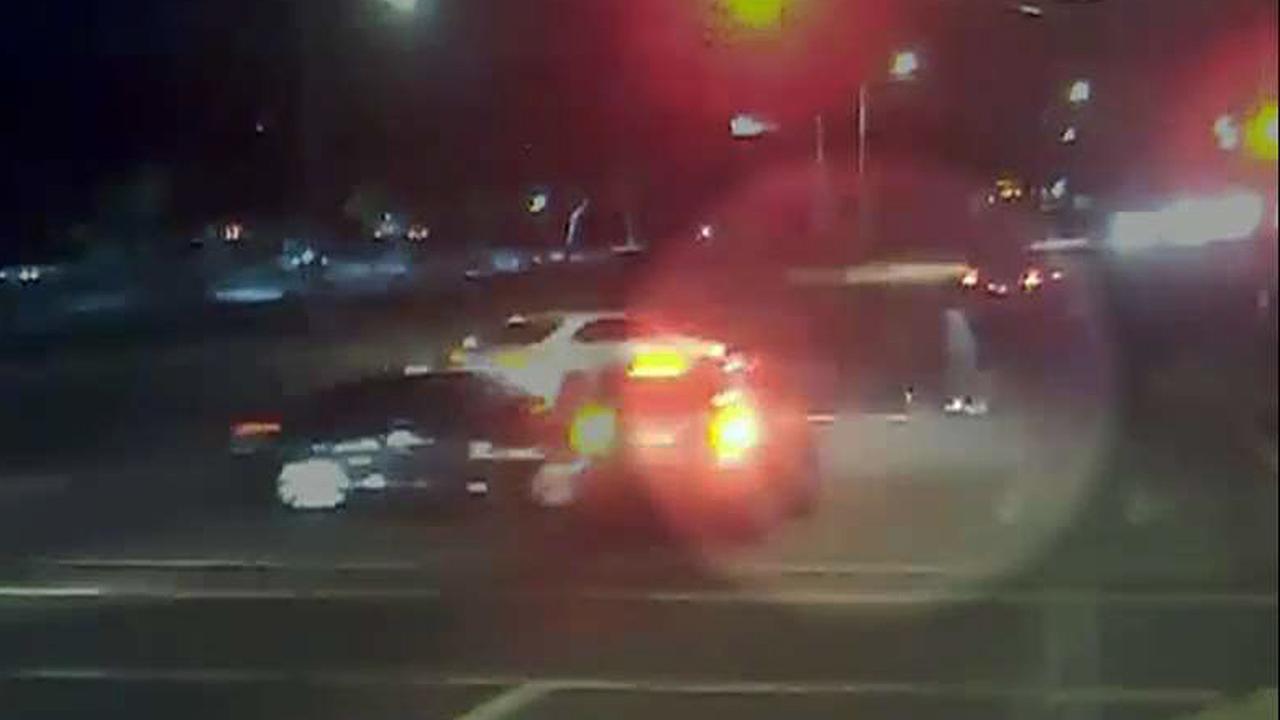 Dramatic video shows car accident near miss with family crossing