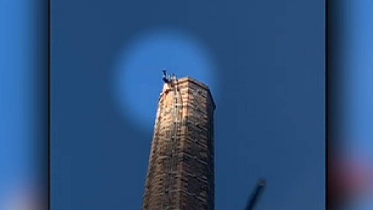 Man stuck on top of 290-foot tall smokestack dies, mage